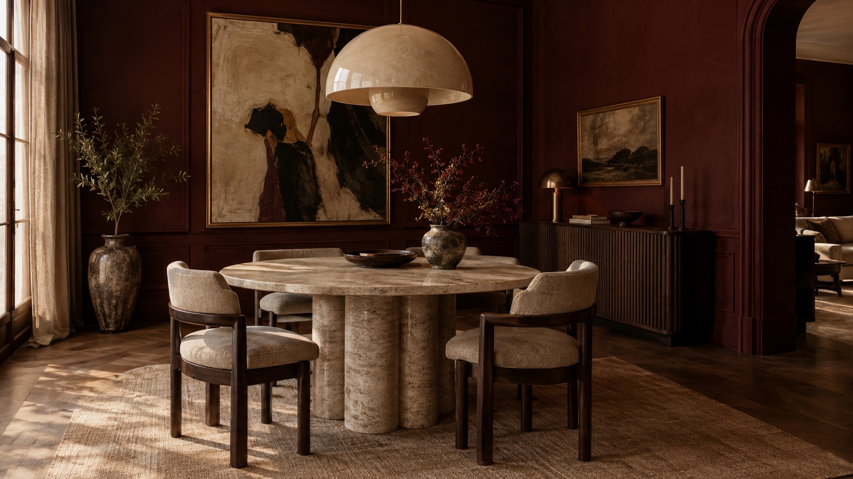 Oxblood dining room with travertine table